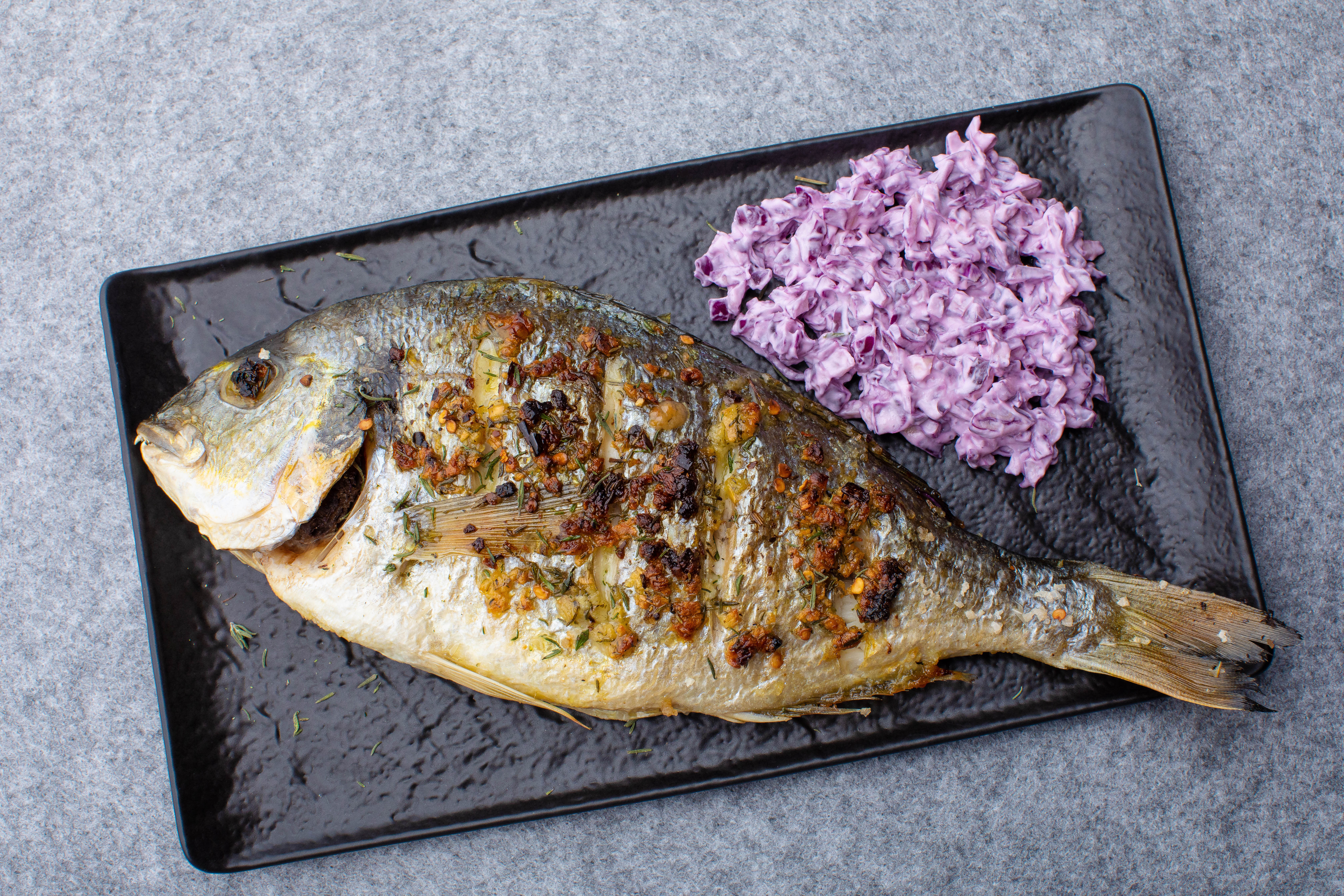 Grilled whole dorada with red cabbage salad